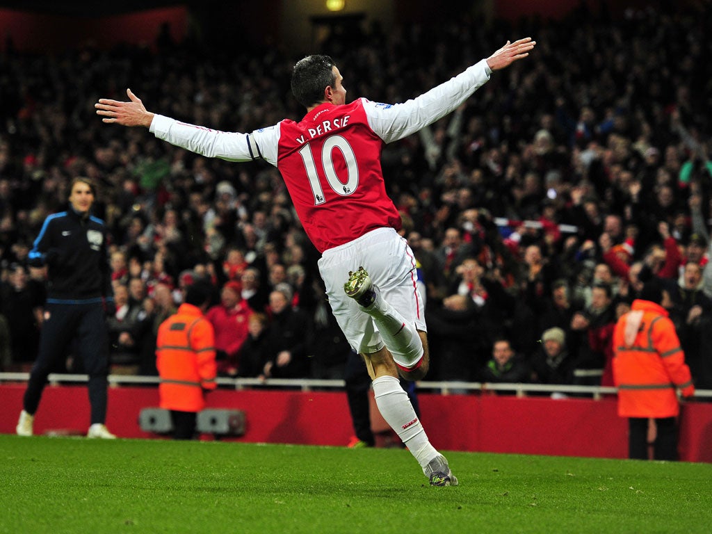 Robin van Persie celebrates after scoring a stunner against Everton in December