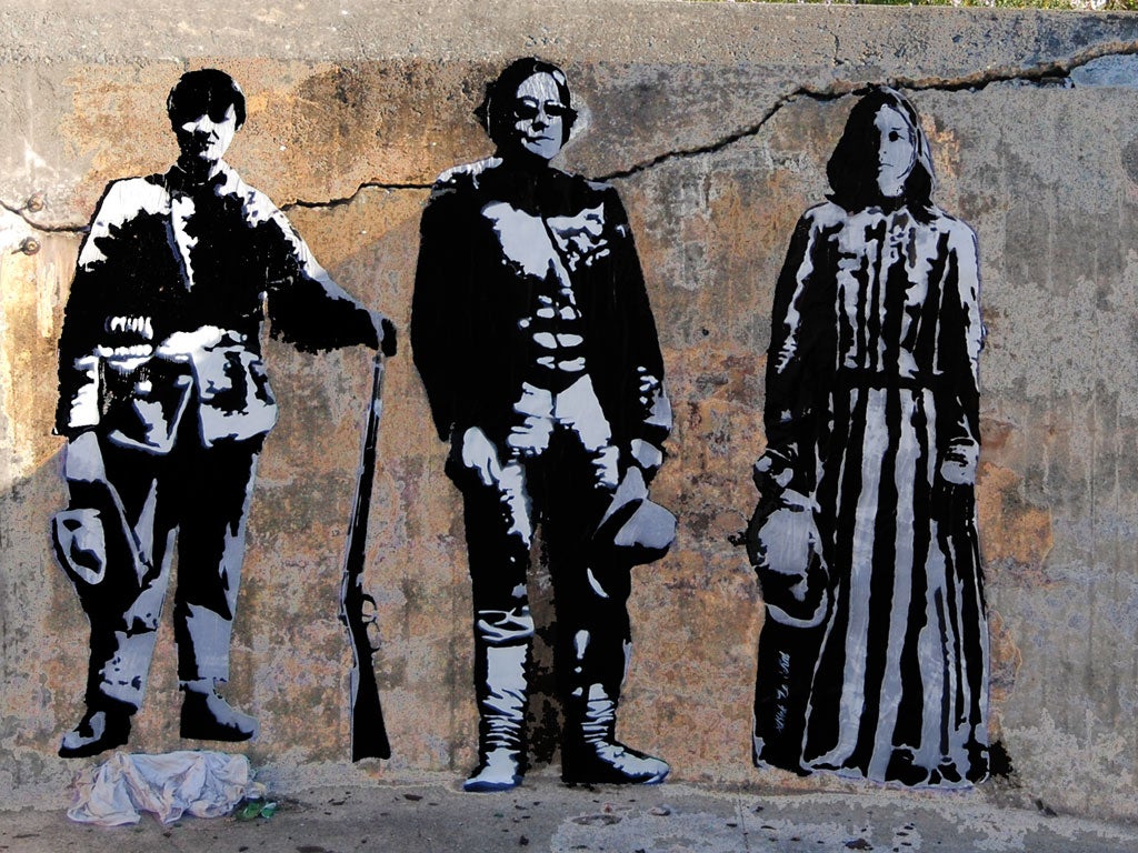 Blek le Rat depicts himself (centre) in one of his street stencils