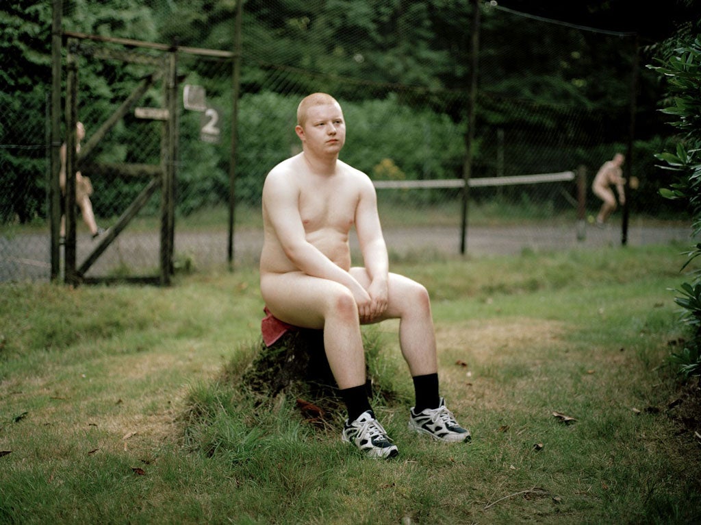 As nature intended: A young man relaxes after a game of naturist-only mini-tennis