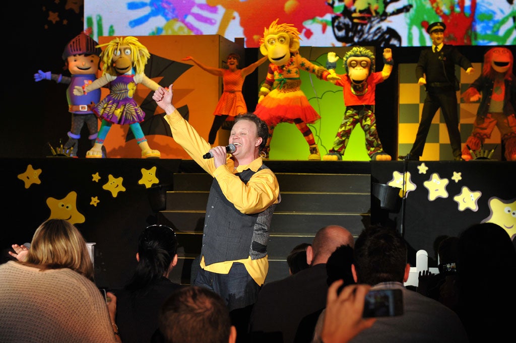 Let's get ready to tumble: Justin Fletcher, aka Mr Tumble, leads Mike the Knight, far left, and various ZingZillas through their paces at 'CBeebies Live'