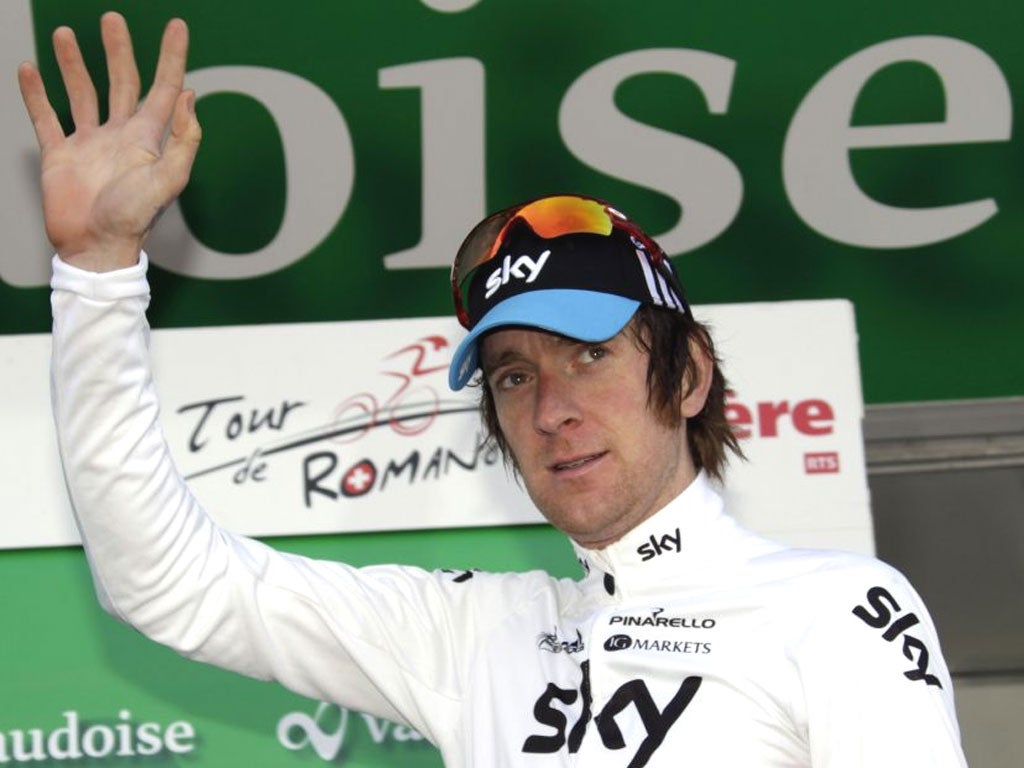 British rider Bradley Wiggins waves after the second stage of the Tour de Romandie cycling race in Moutier