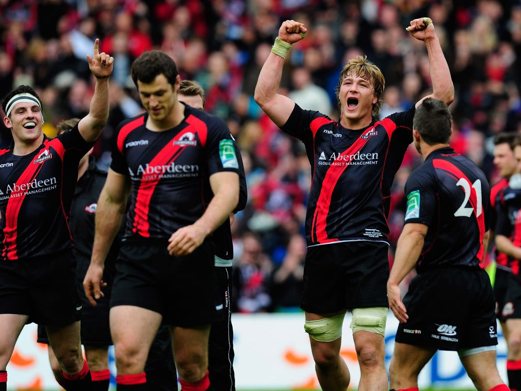Edinburgh forward David Denton (centre) and team-mates celebrate victory over Toulouse