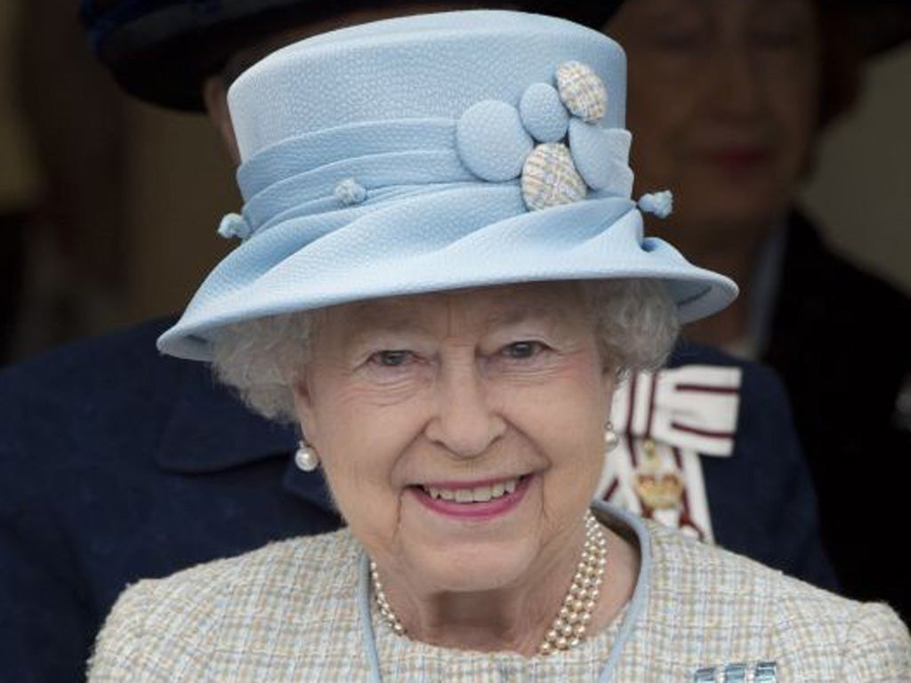 On the job: the Queen yesterday in Aberfan, Wales