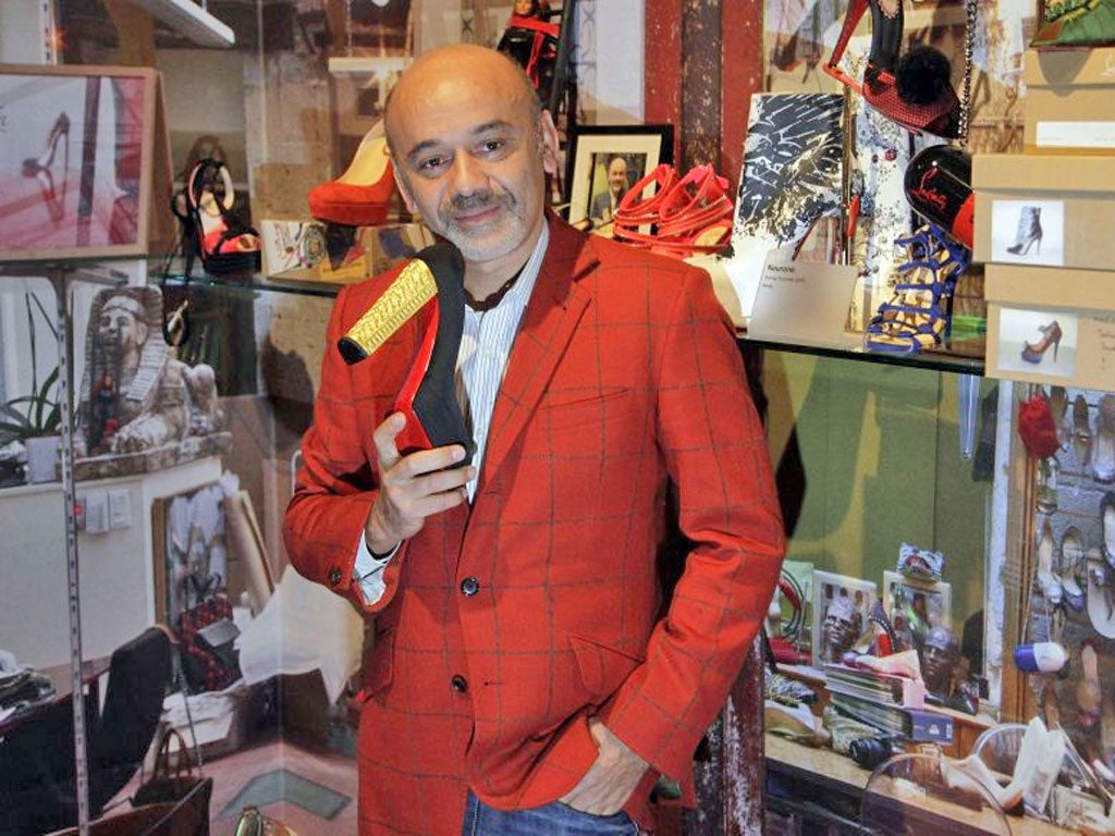 French shoe designer Christian Louboutin attends a preview of an exhibition celebrating 20 years of Christian Louboutin designs at the Design Museum