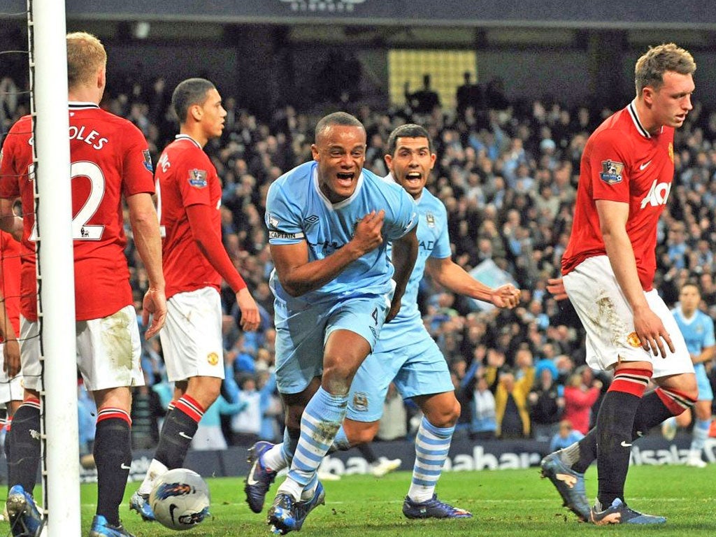 Vincent Kompany wheels away in delight after scoring City’s winner