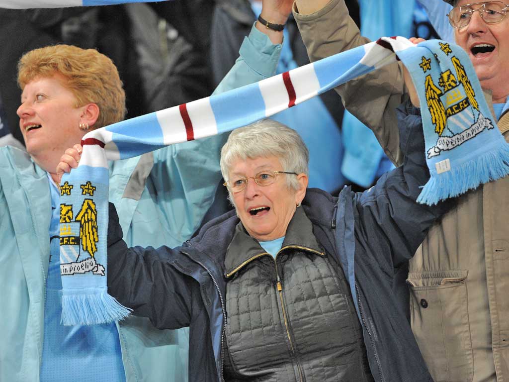 Manchester City fans cheer on their team during Monday's big game