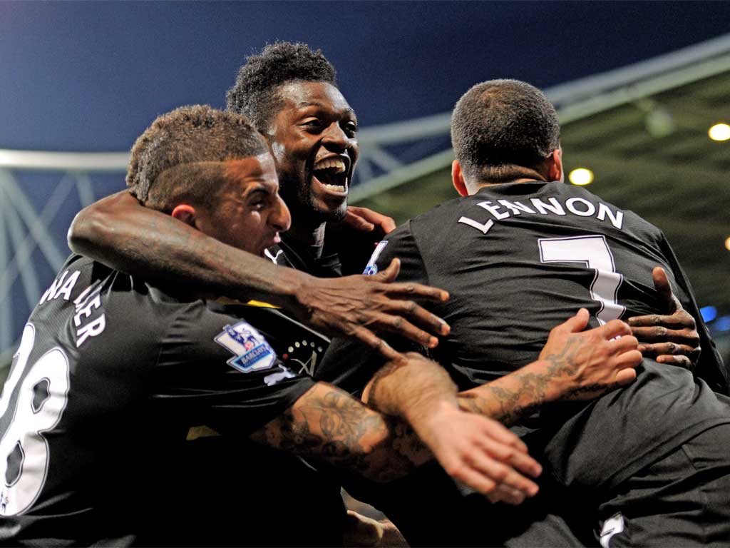 Emmanuel Adebayor (centre) celebrates during Spurs' win