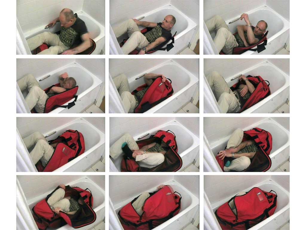 A sequence of police images shown to court of a man trying to lock himself in a sports holdall unaided
