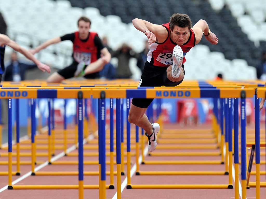 Andy Pozzi competes in the 110m hurdles at the Olympic Stadium