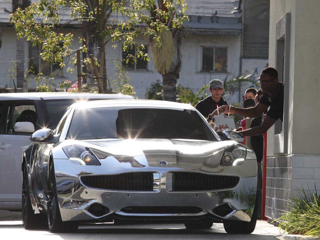 Justin Bieber and Selena Gomez in a brand new Fisker Karma car