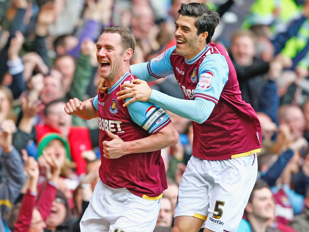 West Ham midfielder Kevin Nolan celebrates scoring the opening goal during the win over Cardiff City