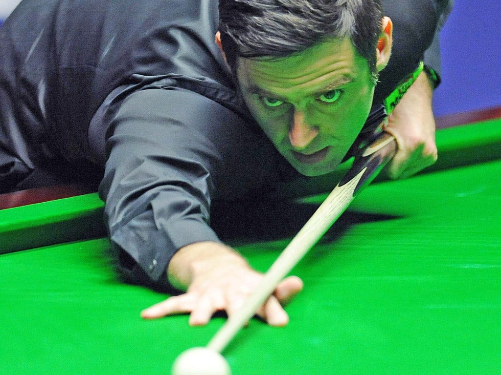 Ronnie O’Sullivan plays a shot lefthanded yesterday