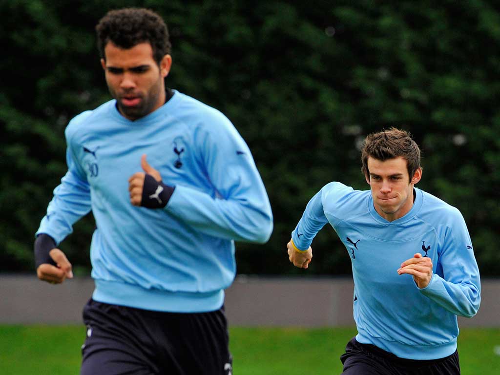 Boy from Brazil: Sandro leads his Tottenham Hotspur team-mate Gareth Bale in a run on the training ground