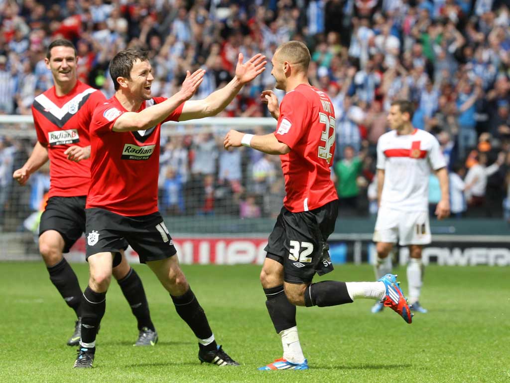 Joy boy: Jack Hunt (right) celebrates scoring Town's second with Damien Johnson