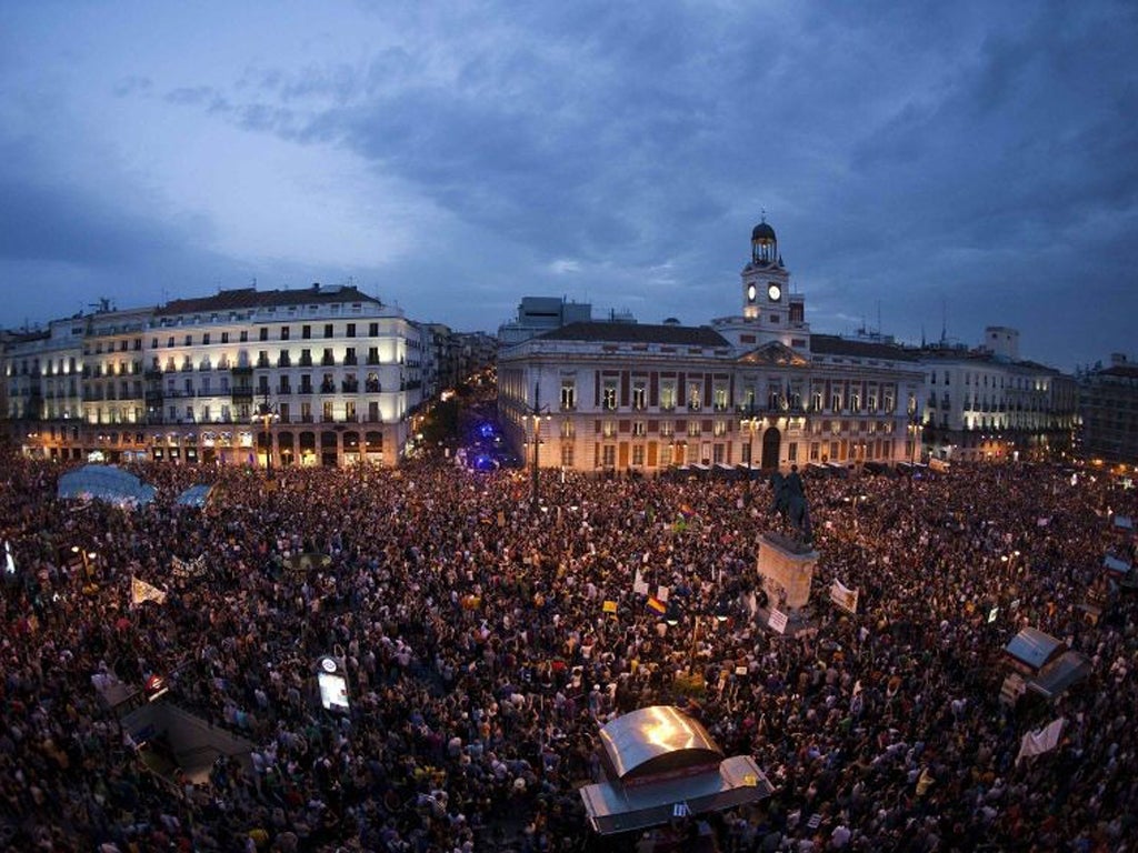 Activists in the Puerta del Sol square during a protest marking the one year anniversary of Spain's Indignados movement in Madrid