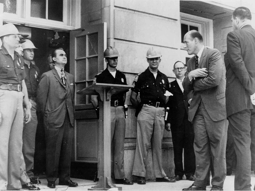 Katzenbach, arms folded, confronts George Wallace at the University of Alabama in Tuscaloosa in 1963