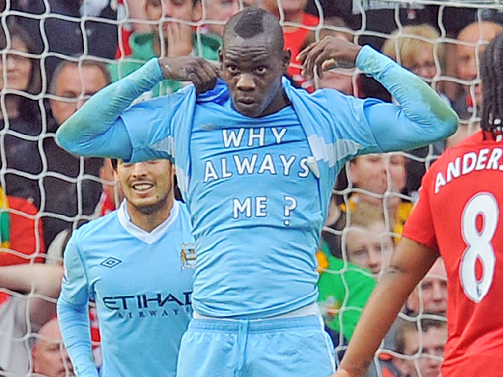 Mario Balotelli reveals his ‘Why Always Me?’ t-shirt during the stunning win