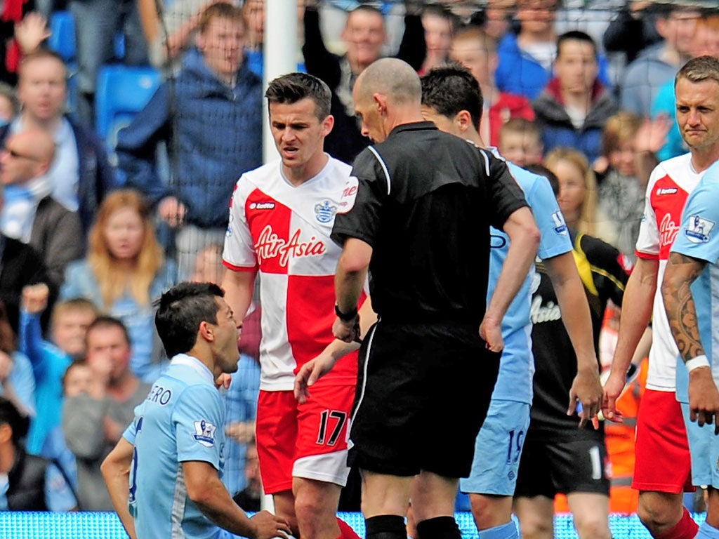 City’s Sergio Aguero is felled by Joey Barton on Sunday