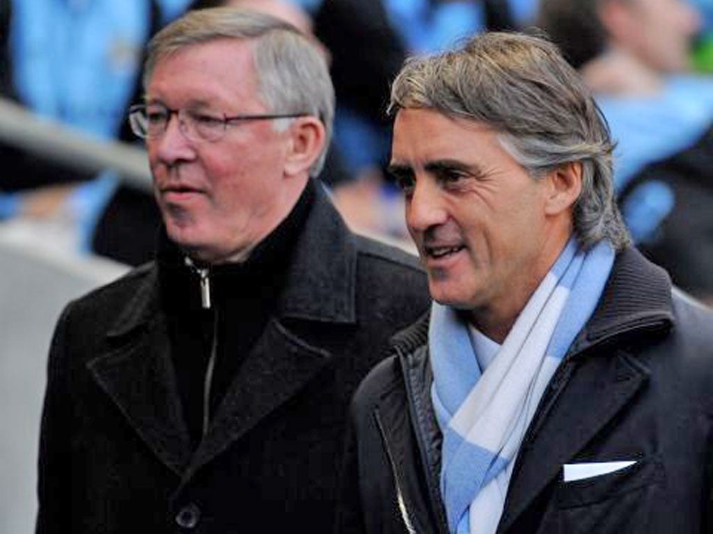 Sir Alex Ferguson (left) lost the title to Roberto Mancini