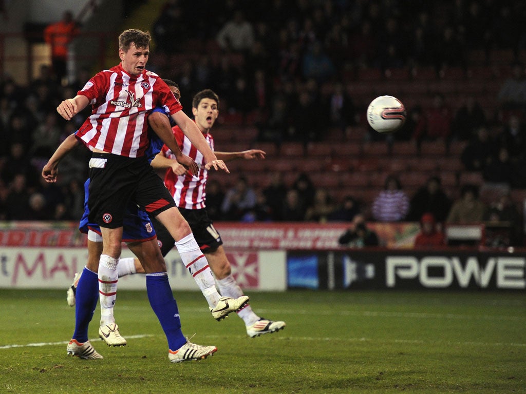 Chris Porter heads the winning goal