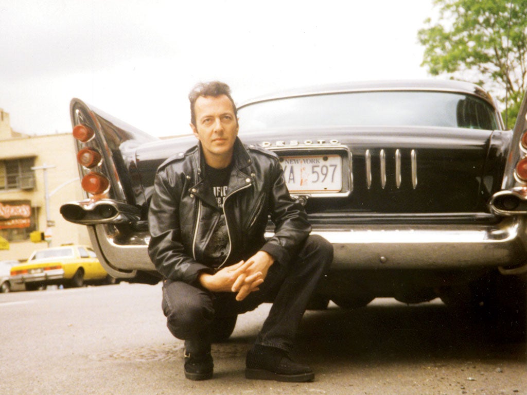 Previously unseen photo of Strummer with a classic car, New York, late 1990s