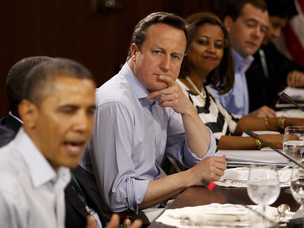 Top table: Cameron and Obama at a G8 lunch yesterday