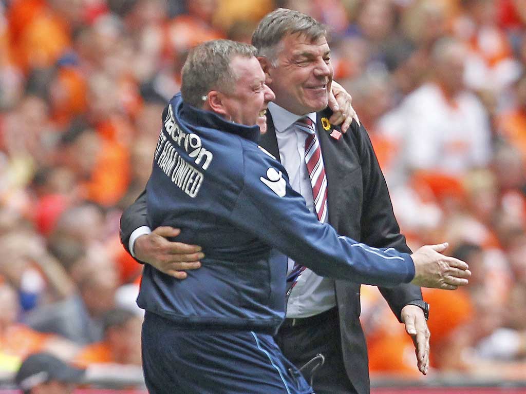 Sam Allardyce celebrates with his first-team coach, Wally Downes