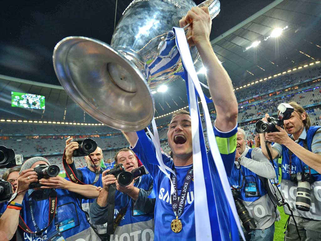 Chelsea’s Frank Lampard holds a loft the European Cup