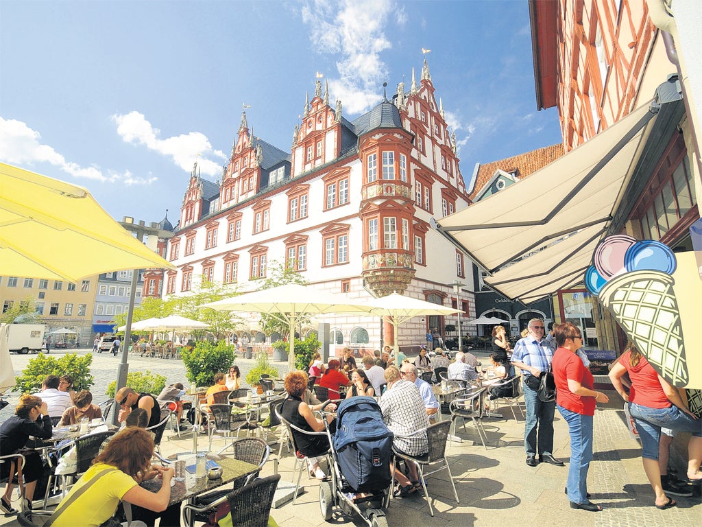 Market square cafés like this one are popular meeting places for students in Coburg, Bavaria