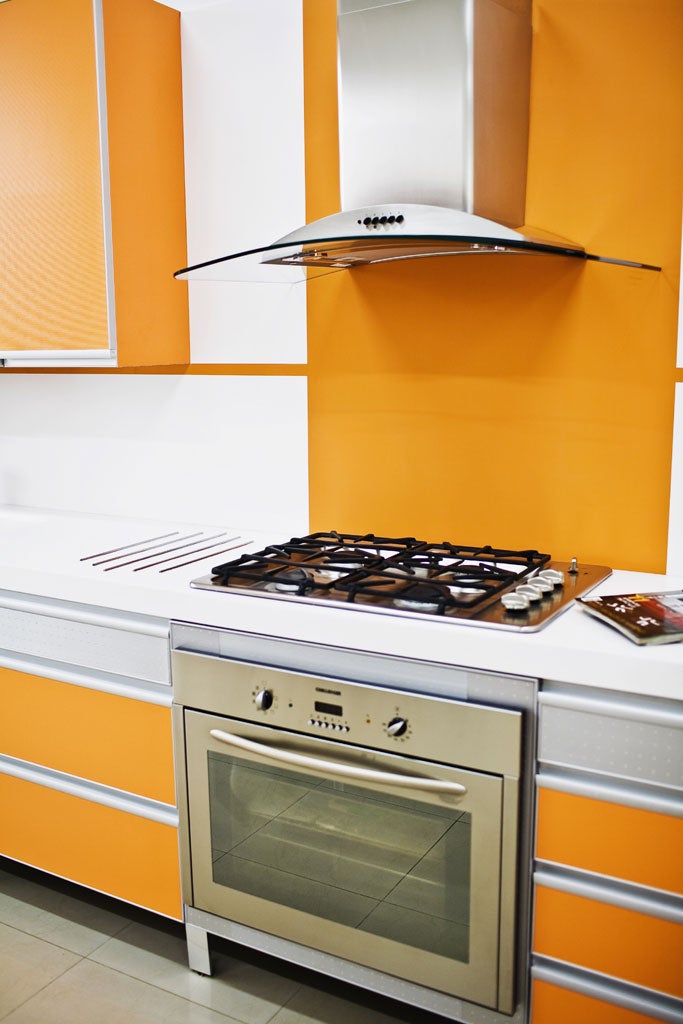 Tangerine dream: Add a coloured acrylic splashback to maintain a room's bright feel