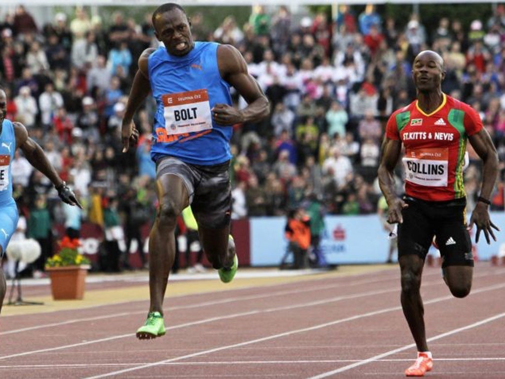 Usain Bolt (left) eased to victory in Ostrava last night