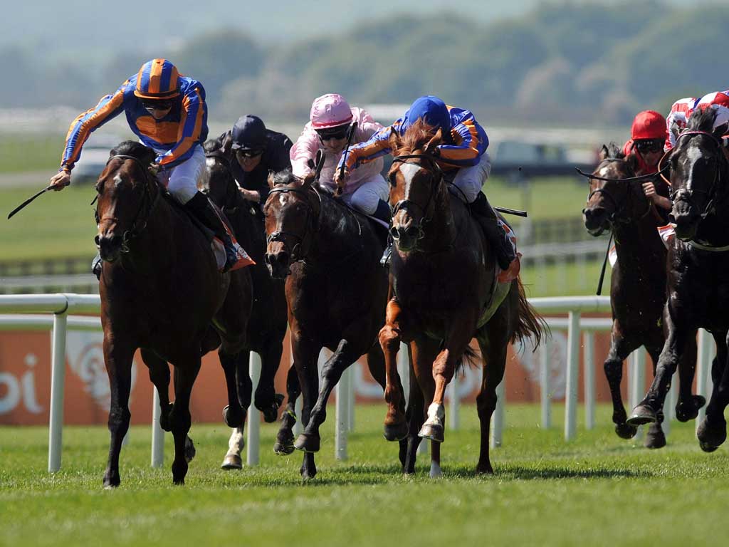 Electric turn of pace: Power (left), ridden by Joseph O'Brien, quickens clear of his rivals in yesterday's Irish 2,000 Guineas at the Curragh