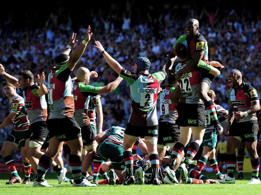 Mighty quins: Harlequins' players celebrate at the end of the Premiership final against Leicester