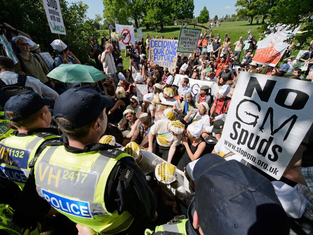 Protesters stage a sit-in as they take part in a demonstration by the "Take the Flour Back" group in Harpenden