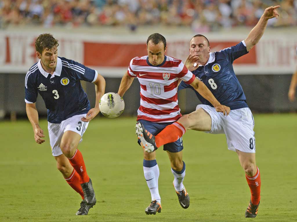 Landon Donovan, who scored a hat-trick, attacks against Scotland