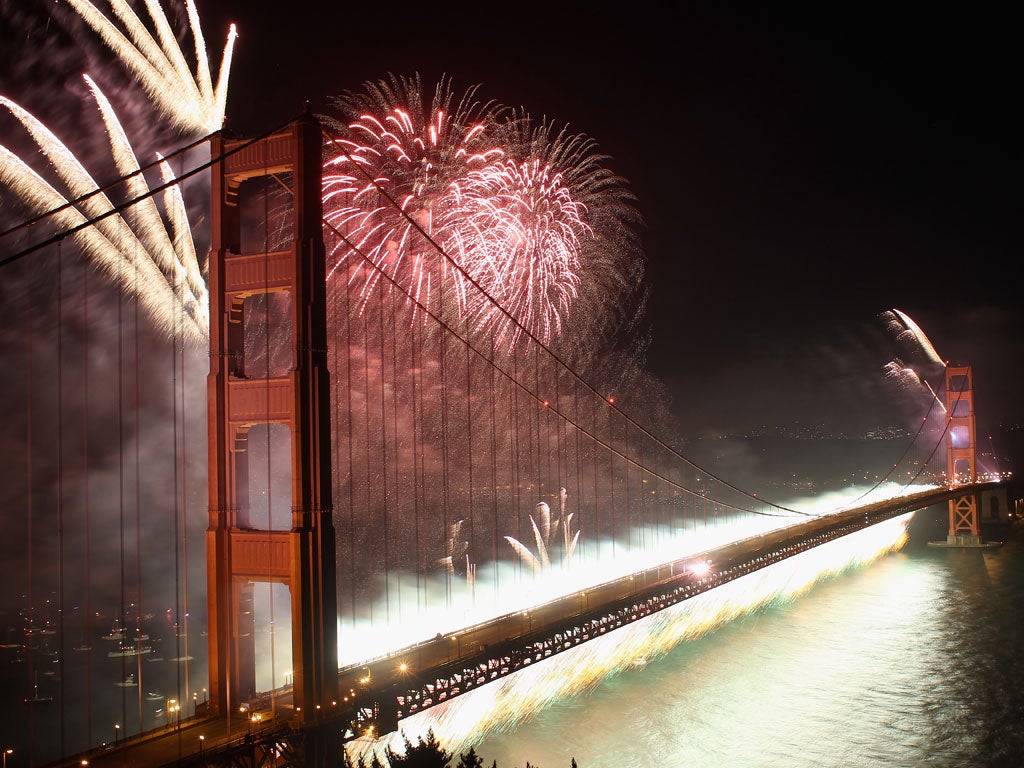 Fireworks explode over the Golden Gate Bridge on Sunday
