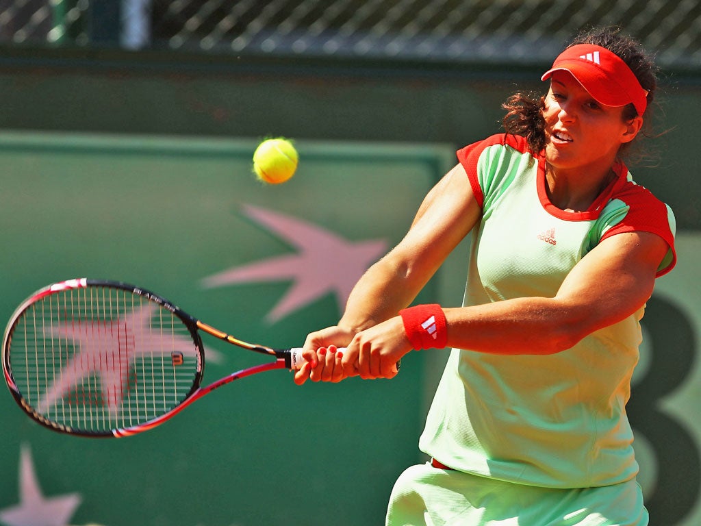 Laura Robson plays a backhand on her way to defeat by Anabel Medina Garrigues