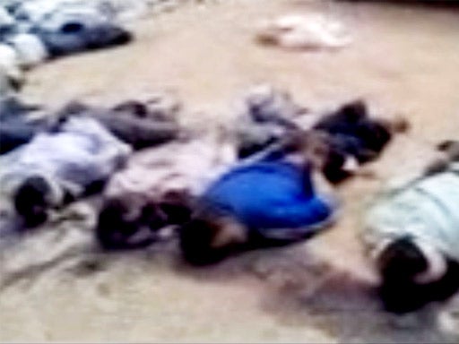 An image released by the Syrian opposition shows blindfolded and handcuffed bodies on the ground in Deir el-Zour