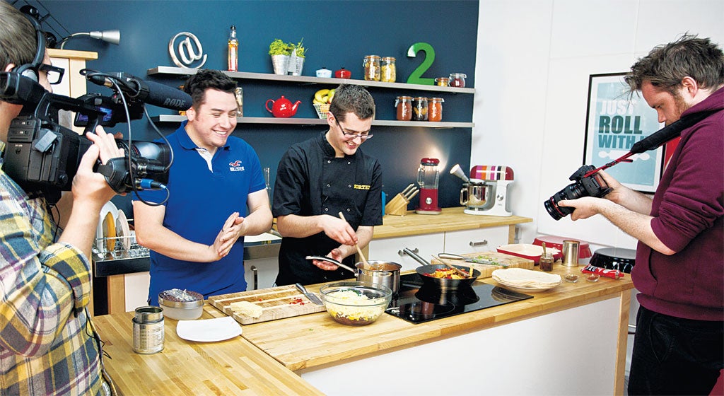 Kitchen boys: Tom Hemsley (far left) films Jamie Spafford (left) and Ben Ebbrell for their latest video for Sortedfood.com, their online cooking show, in their studio