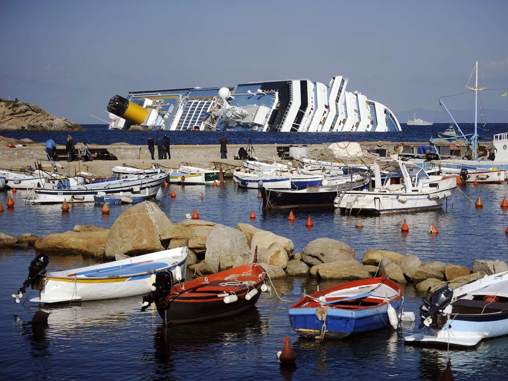 Far from being the elephant in the room, the wreck of the Concordia has boosted Giglio; Captain Francesco Schettino, top right, who has been charged with causing the accident