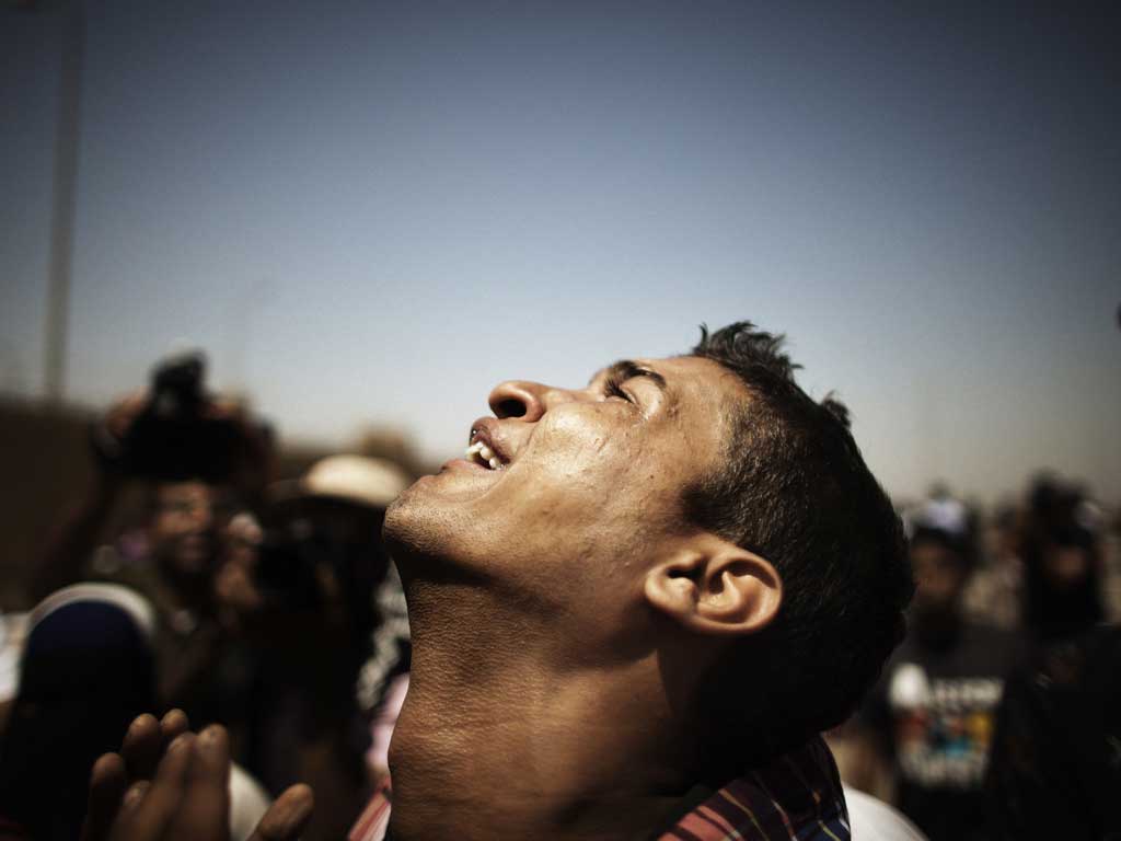 Outside a Cairo court yesterday a man reacts to hearing the sentence on the country's 84-year-old former dictator, Hosni Mubarak