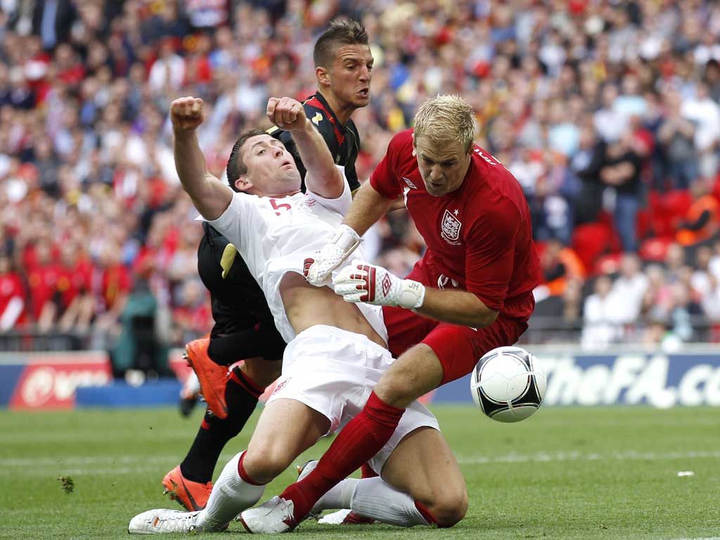 Jawdropper! Gary Cahill collides into goalkeeper Joe Hart