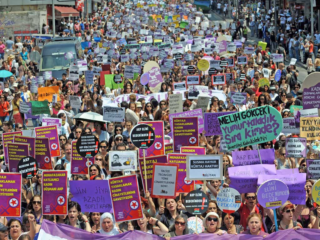 Women hold placards in Kadikoy Square, Istanbul, as they protest against Prime Minister Erdogan’s plan for a tough
abortion law. He said he considered abortion to be “murder”