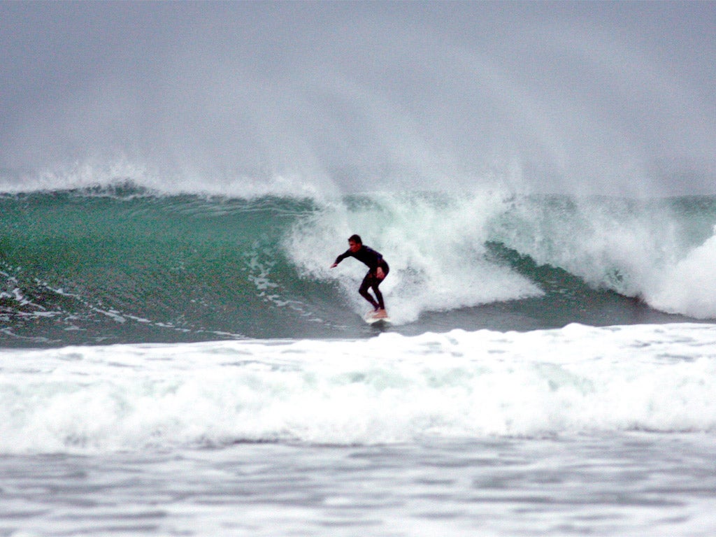 Board meetings: a surfer braves the English waves near St Ives