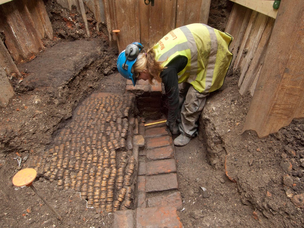 Archaeologists undertaking the initial excavation work at The Curtain Theatre