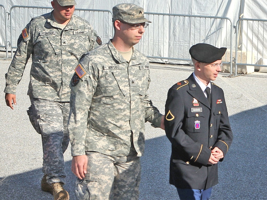Bradley Manning is escorted to a military court in Fort Meade, Maryland, yesterday for the first day of a three-day hearing