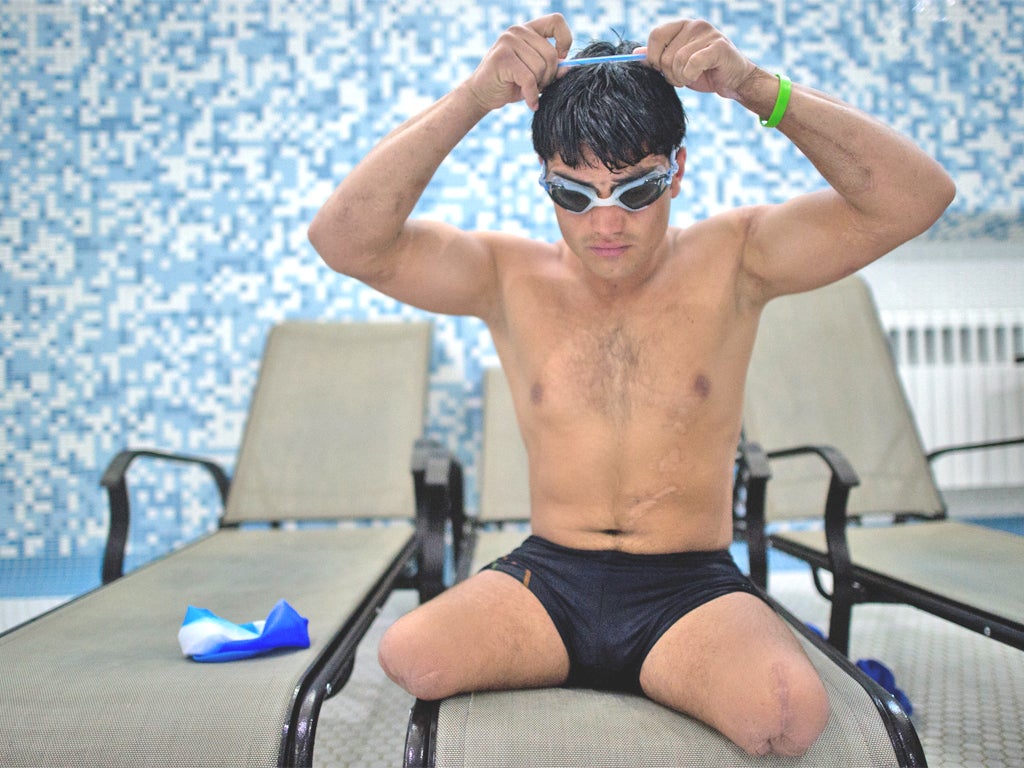 Malek Mohammed prepares for a training swim in Kabul