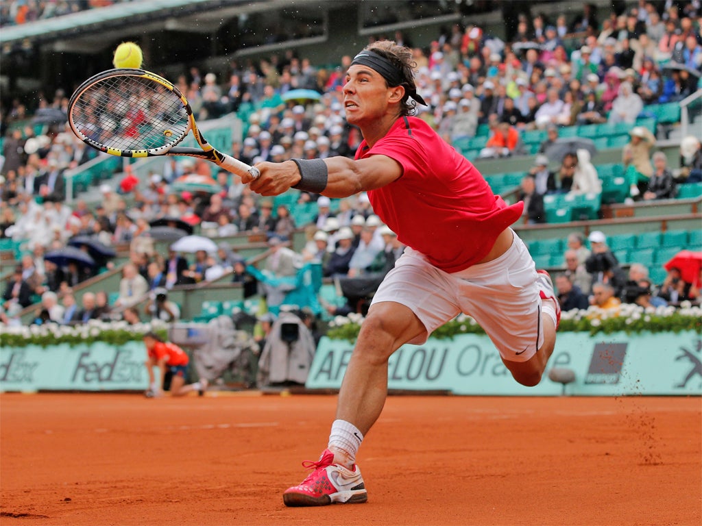 Rafael Nadal plays a return against Nicolas Almagro at Roland Garros