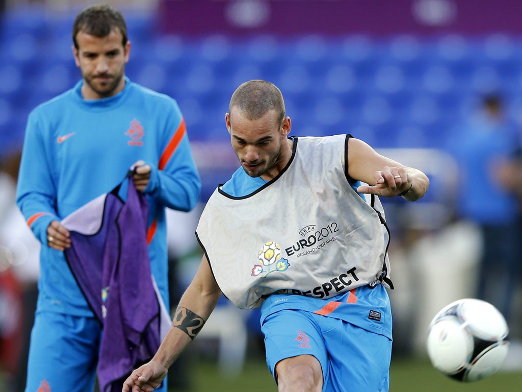 Wesley Sneijder trains with Rafael van der Vaart at the Metalist Stadium in Kharkiv yesterday