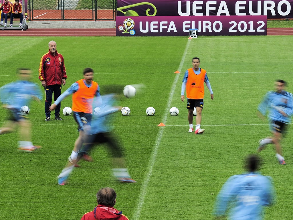 Coach Vicente del Bosque (top left) overlooks the preparations of his Spain squad ahead of their Euro 2012 opener against Italy